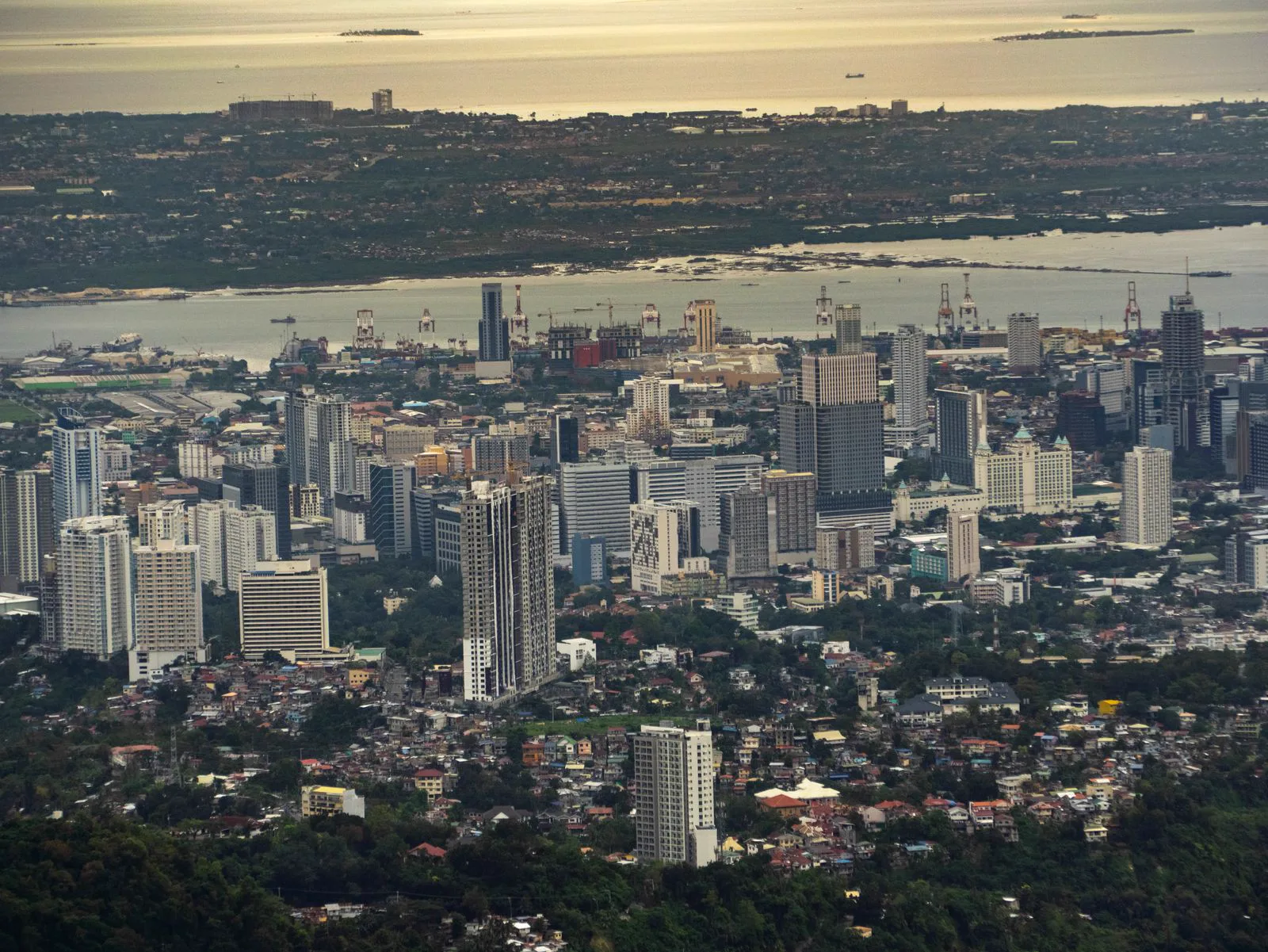 Panorama of Cebu City — the skyline, the Mactan Channel, and the sea beyond