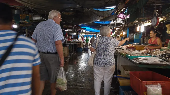 A couple shopping at a local wet market