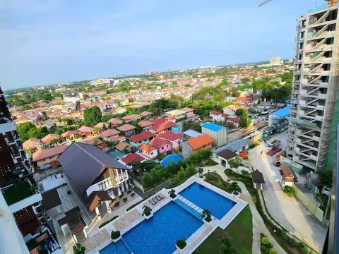 A condo pool and gardens seen from above