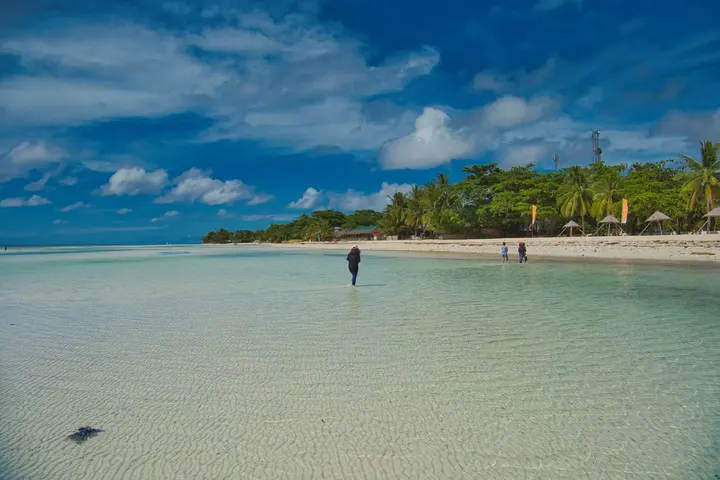 A white sand beach and shallow clear water on Bantayan Island